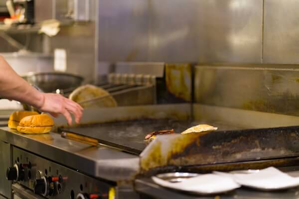 Quick service restaurant chain kitchen with standardized ESP grease filtration