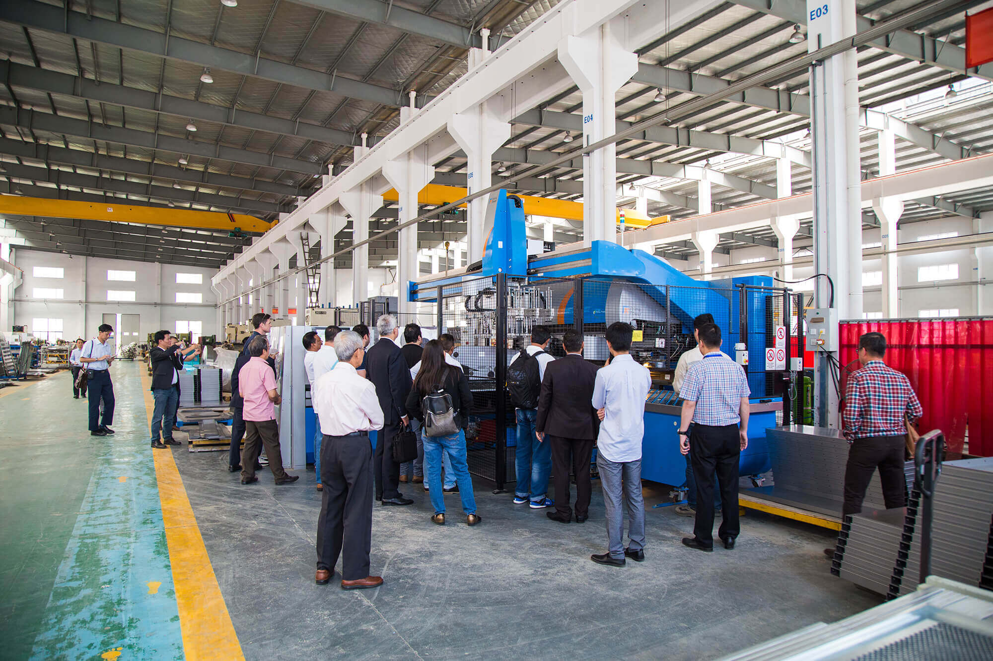 Visitors touring production line